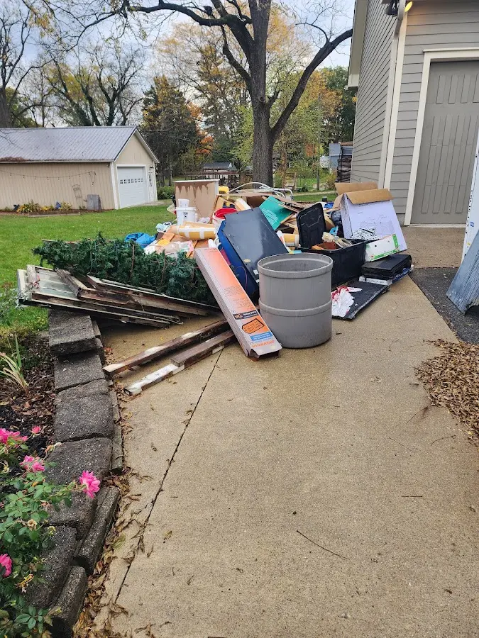 Dumpster being loaded with debris for Commercial Dumpster Rental in Richmond